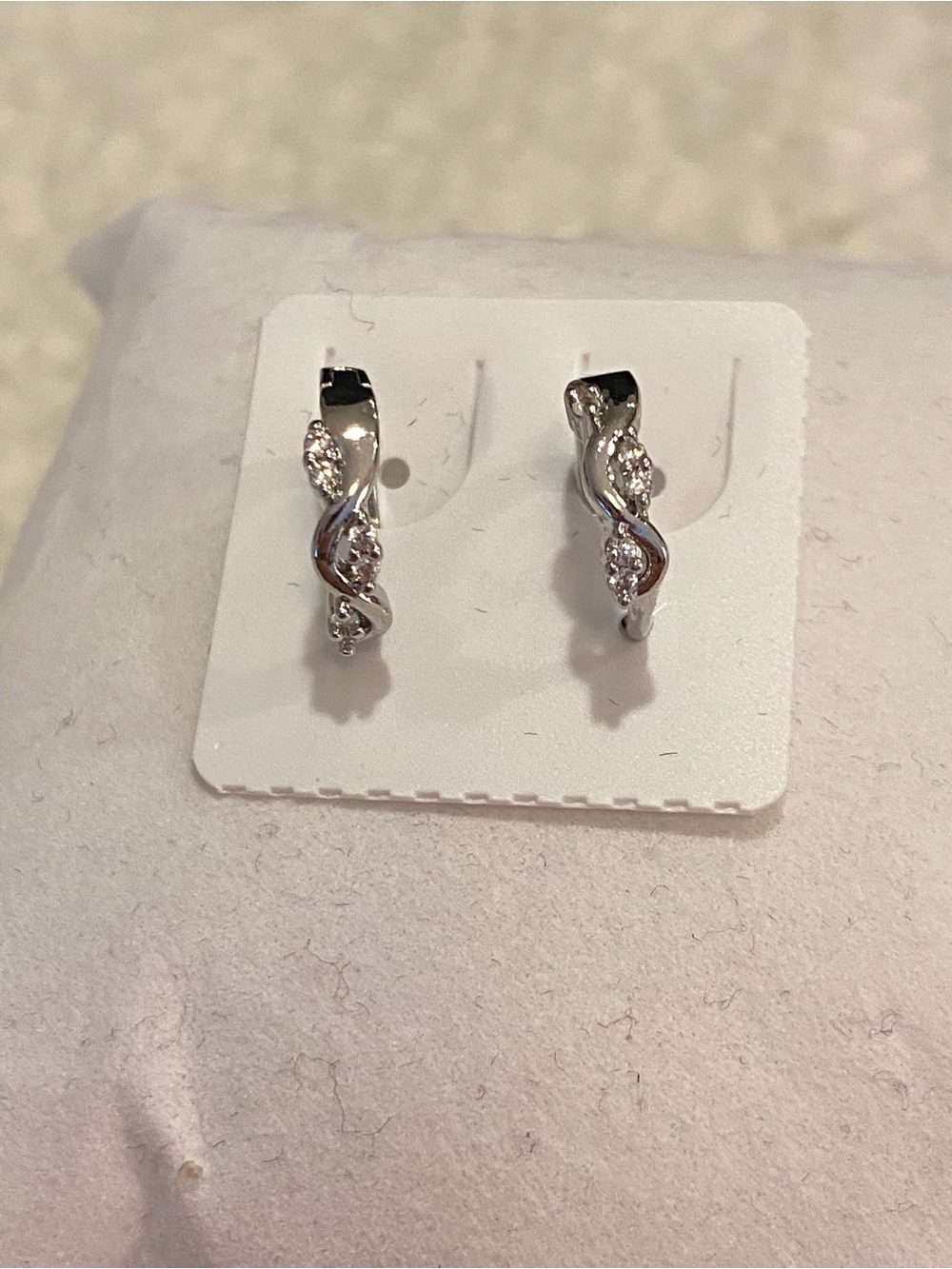 Silver Twisted Hoop Earrings with Clear Stones